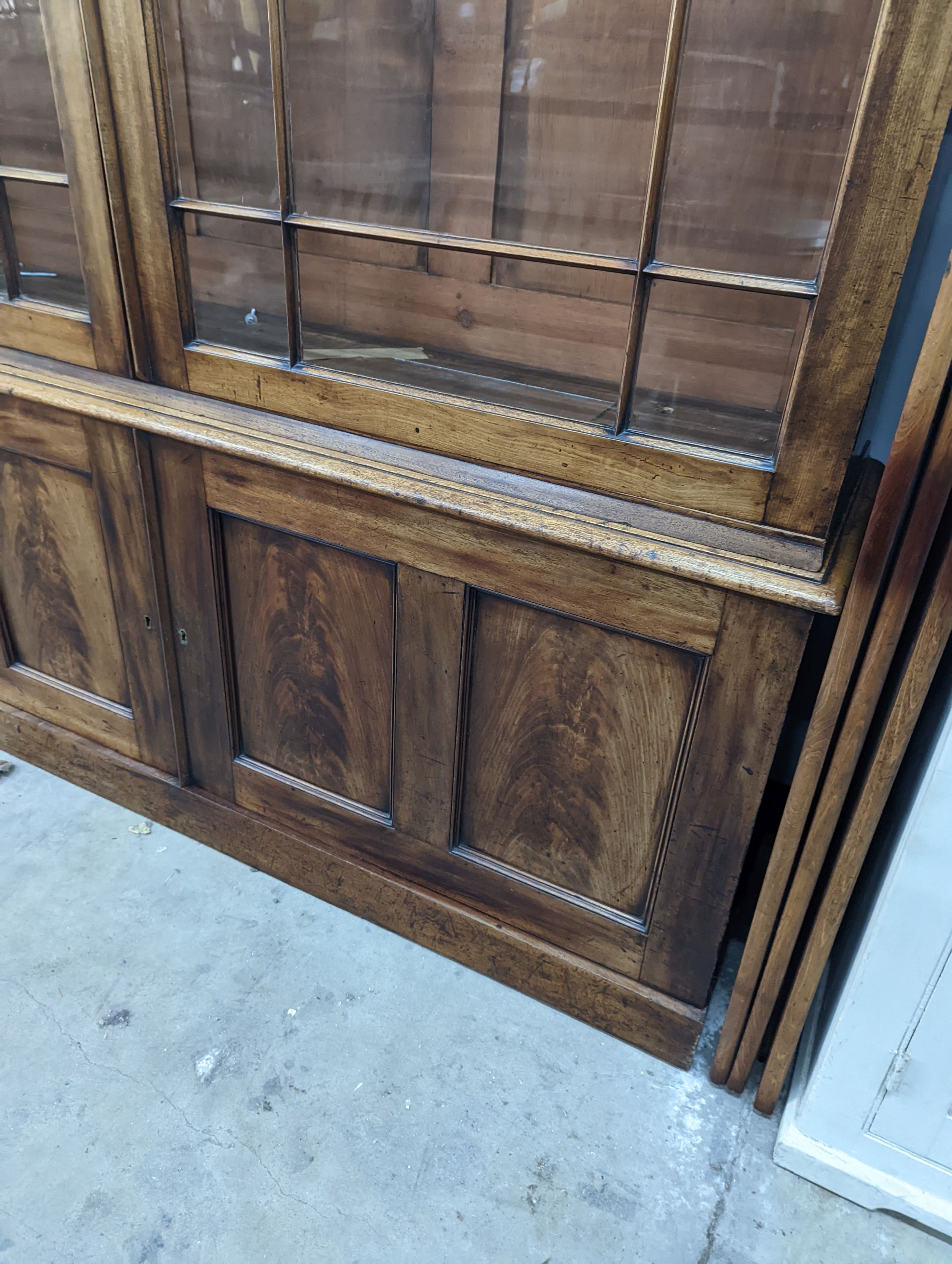 A George III style mahogany library bookcase, width 154cm, depth 38cm, height 217cm